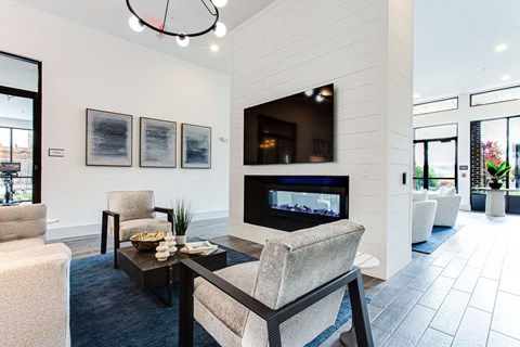 a living room with a fireplace at The Indigo Apartments, Canton, GA