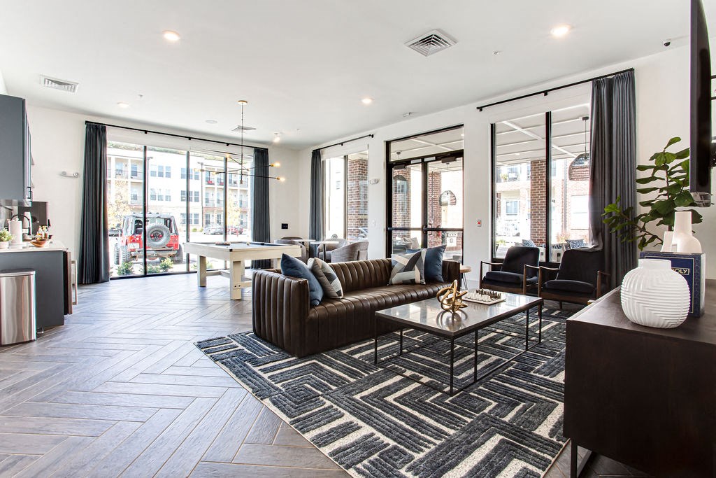 a living room with a couch and a table at The Indigo Apartments, Canton, 30114