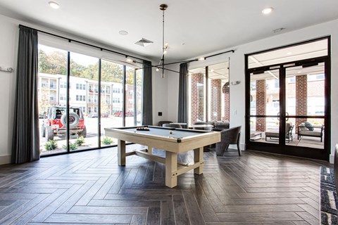a game room with a pool table and sliding glass doors at The Indigo Apartments, Georgia, 30114
