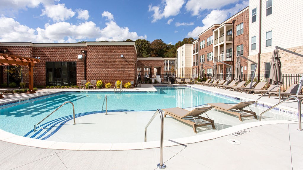 our apartments offer a swimming pool with lounge chairs at The Indigo Apartments, Georgia, 30114