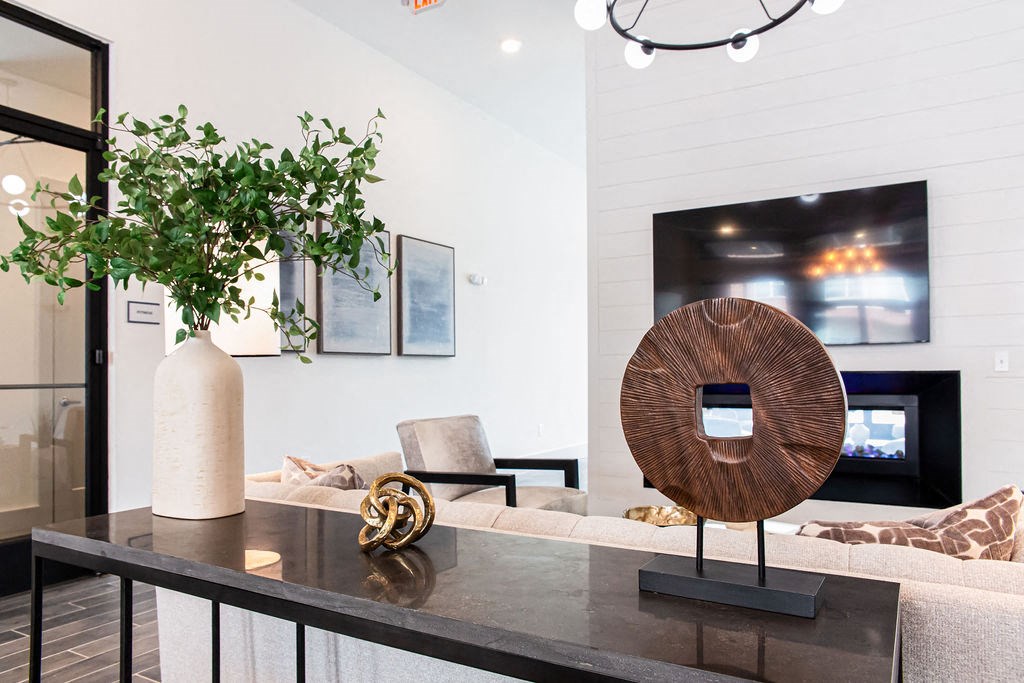 a living room with a couch and a table at The Indigo Apartments, Canton, GA, 30114