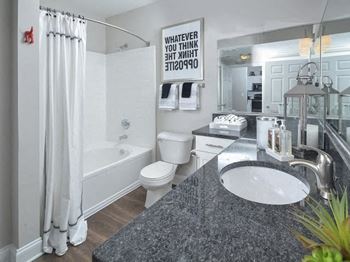 Renovated Bathrooms With Quartz Counters at Crest at Midtown, Atlanta