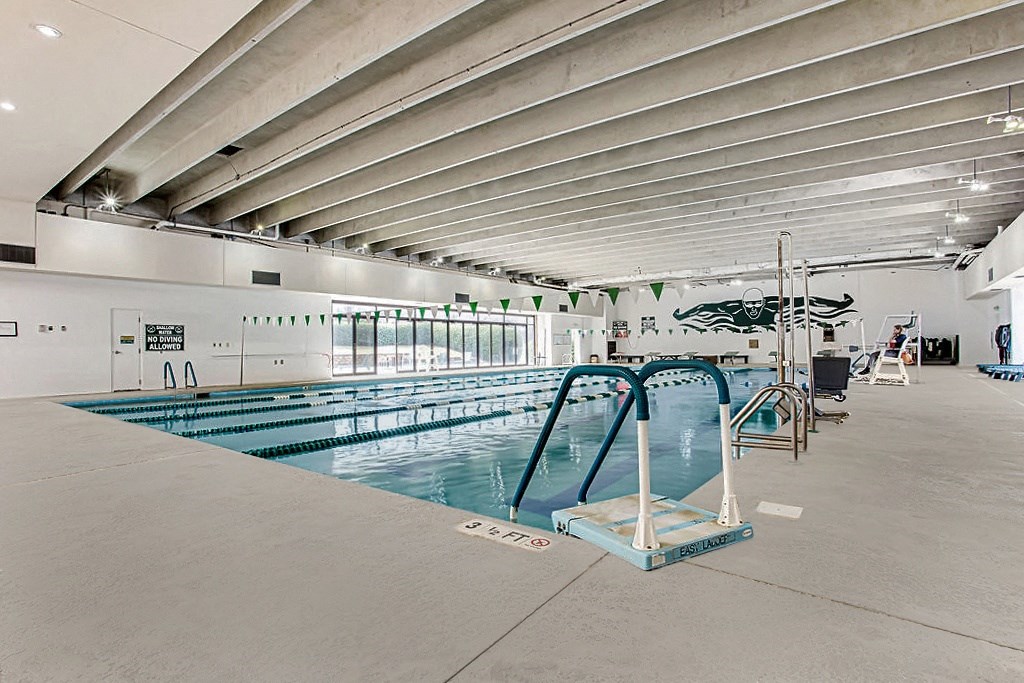 a large indoor swimming pool with a diving board at Lory of Harbison, South Carolina, 29212