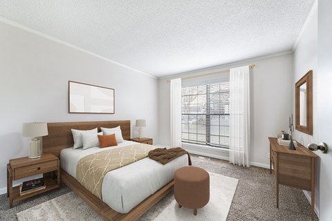 A bedroom with a large bed, a nightstand, and a window with blinds.