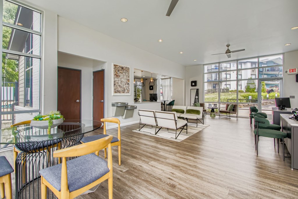 A modern office space with wooden floors and furniture.