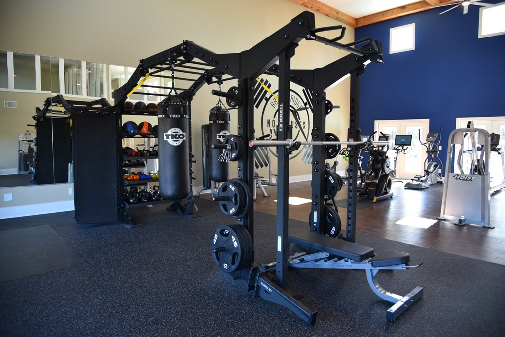 a gym with weights and other gym equipment at Breckinridge Vue, Duluth, GA