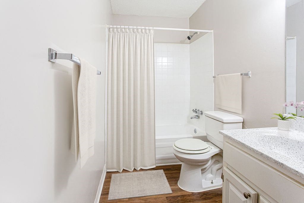 a bathroom with a toilet and a bathtub at Lory of Harbison, Columbia, SC