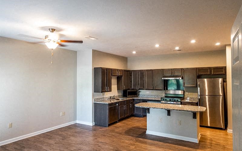 a kitchen with stainless steel appliances and a granite counter top