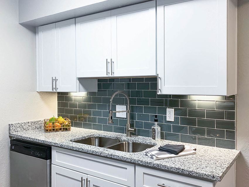 Granite Countertop With Tile Backsplash at Latitude at Riverchase, Hoover, AL