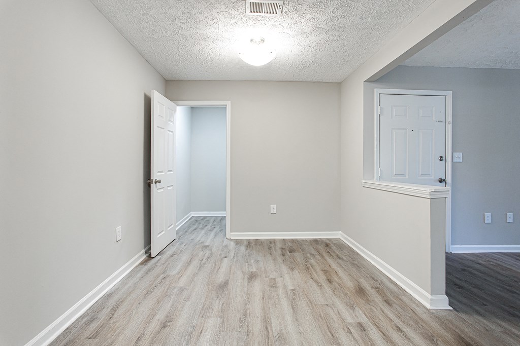 A dinning area with hard wood like flooring Ascend at Stone Mountain apartments. Stone Mountain, GA 30088.