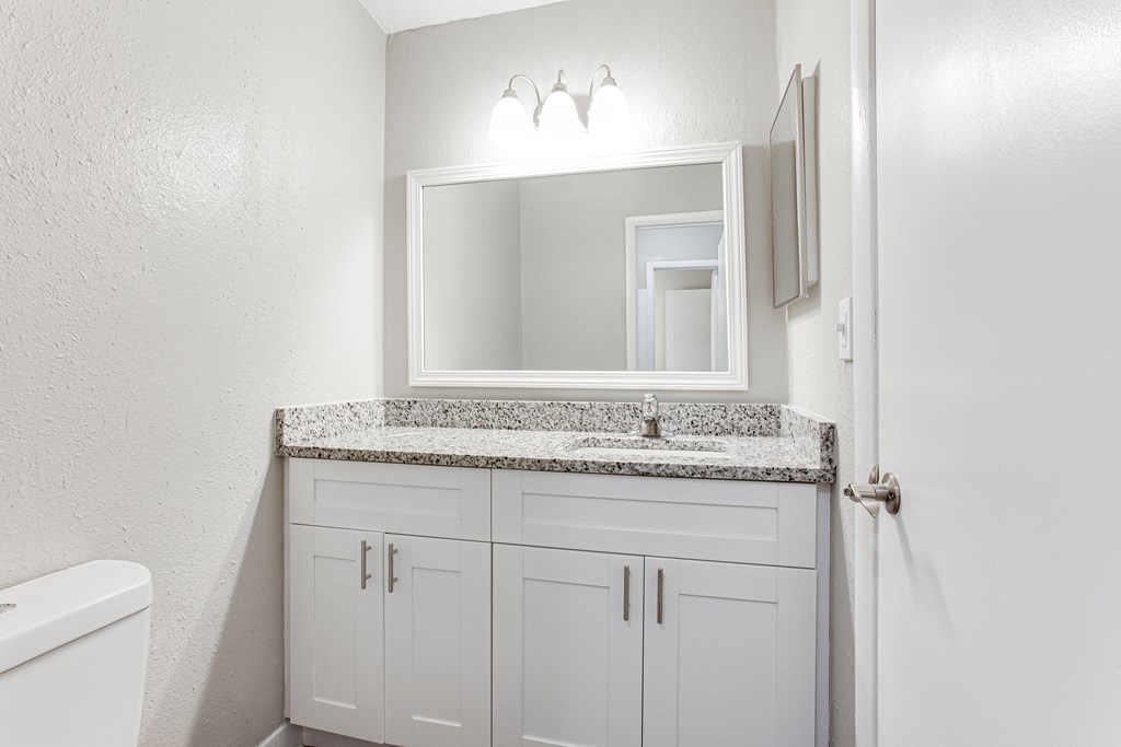 a bathroom with a sink and a mirror  at Barcelo at East Cobb, Marietta, Georgia