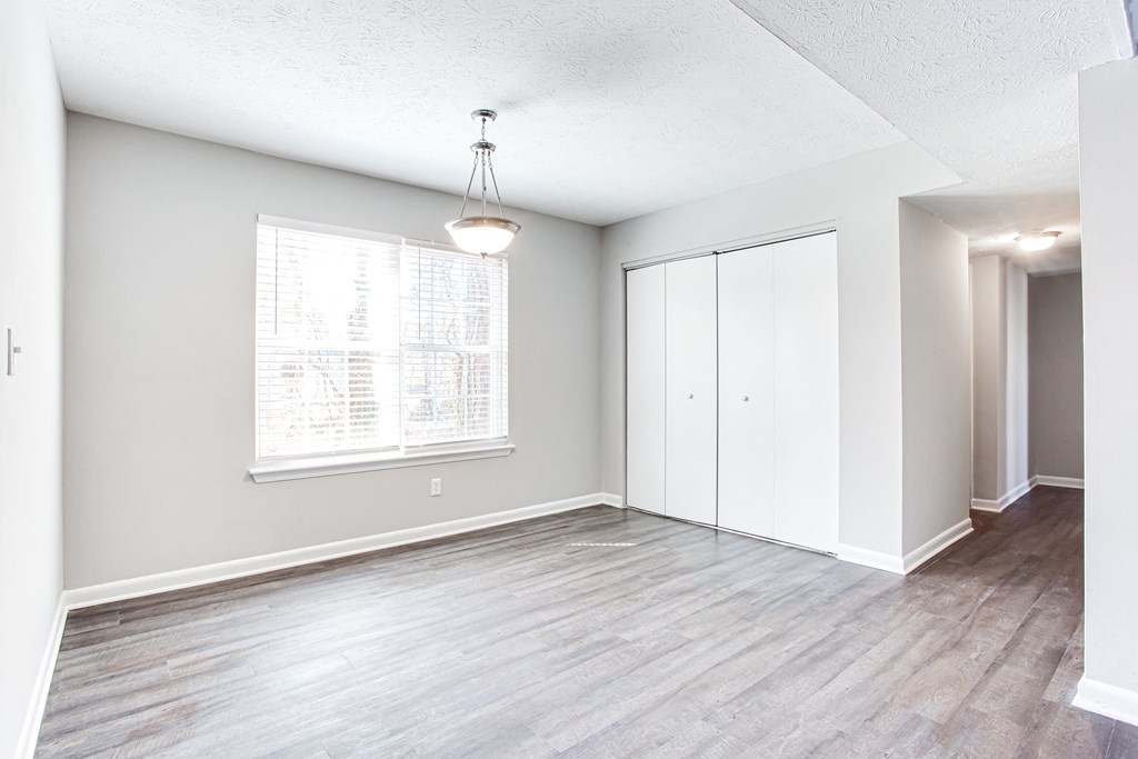 a bedroom with hardwood flooring and a large window at Barcelo at East Cobb, Georgia, 30067