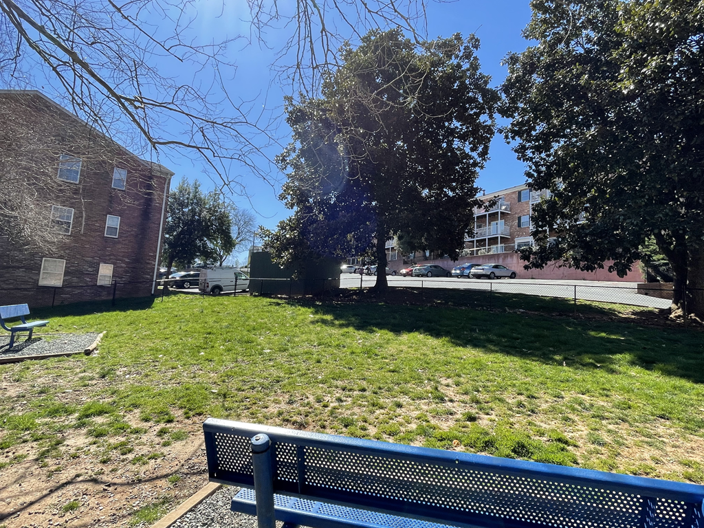 a park bench in front of a building at Barracks West in Charlottesville, VA