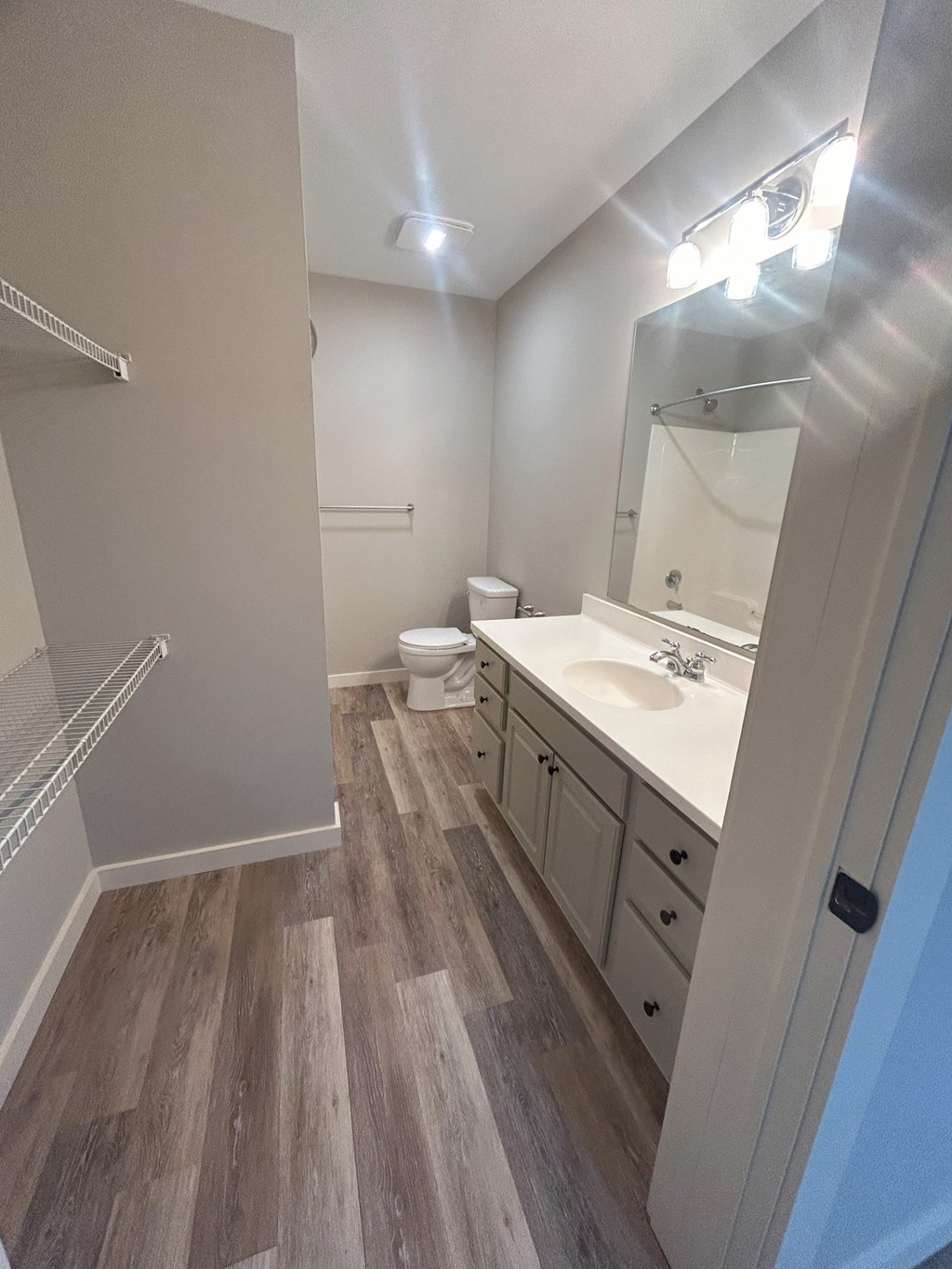 a bathroom with a sink and a shower and a toilet at Briarcliff at Quechee Apartments, Quechee, Vermont