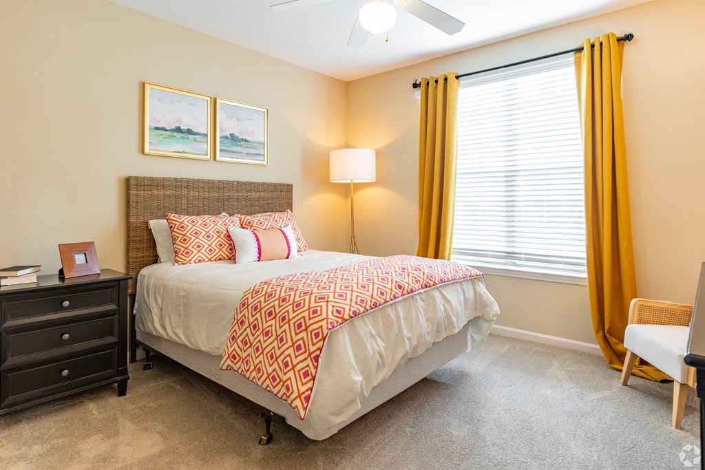 Overlook at Gwinnett Stadium spacious bedroom featuring large window. Lawrenceville, GA