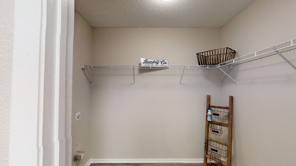 a walk in closet at the enclave at woodbridge apartments in sugar land, tx  at Breckinridge Vue, Duluth, 30096