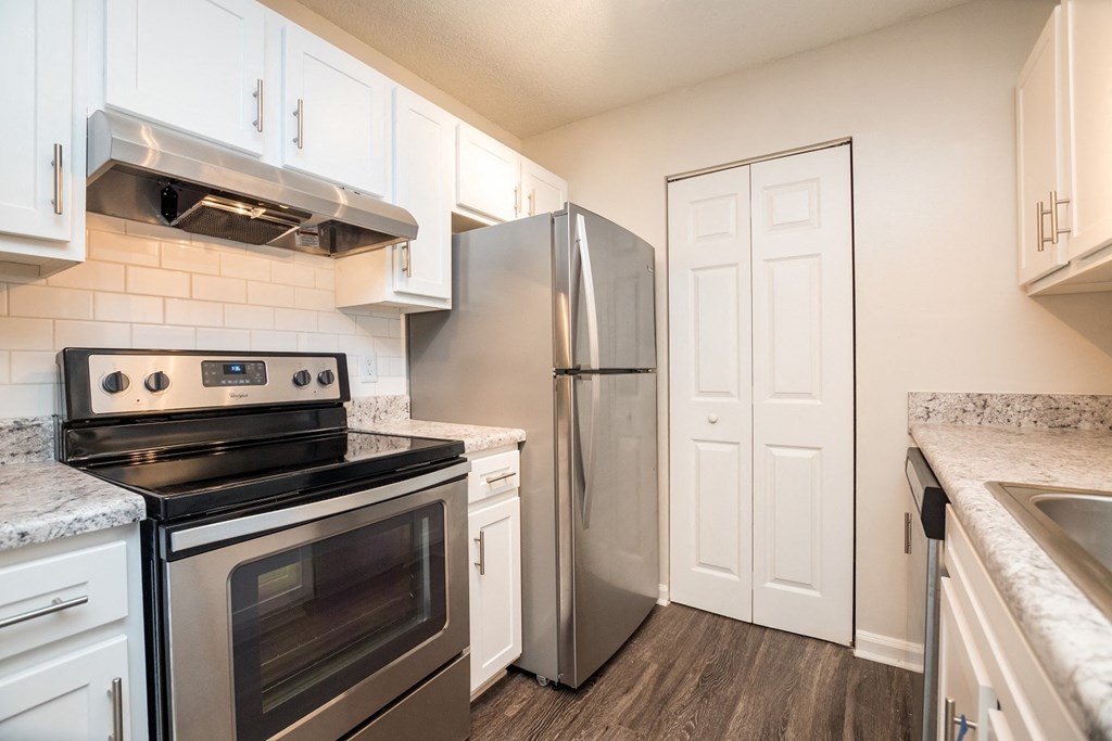 model apartment kitchen with stainless steel appliances at Palmetto Place, Fort Mill, 29708