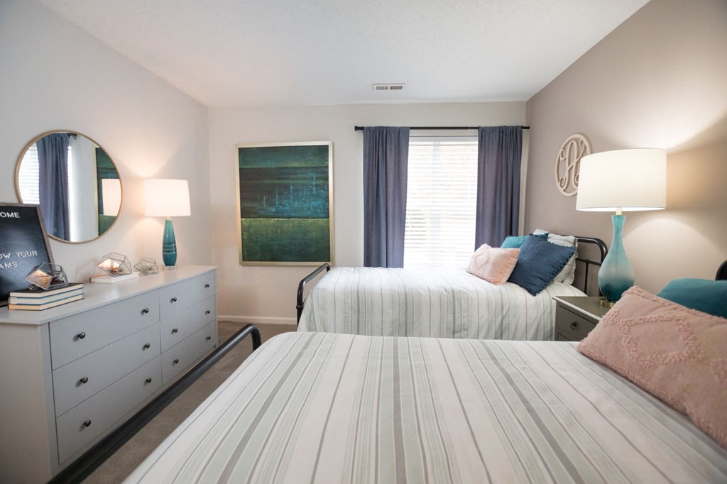 Carolina model apartment bedroom with two beds at Palmetto Place, South Carolina