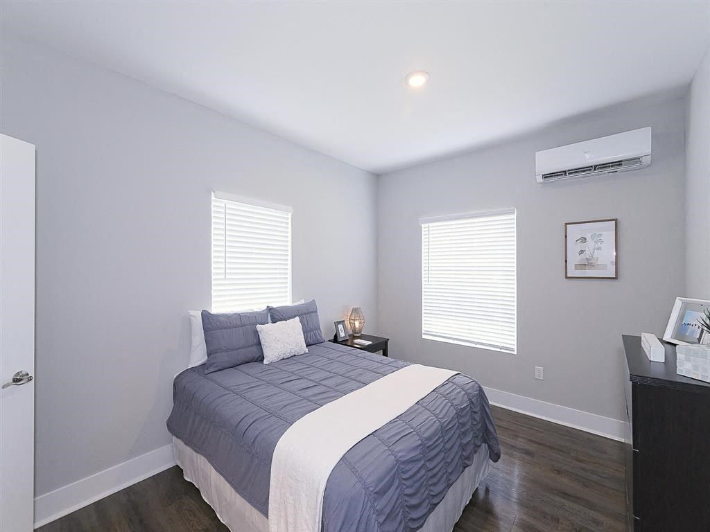 a blue and white bedroom with a bed