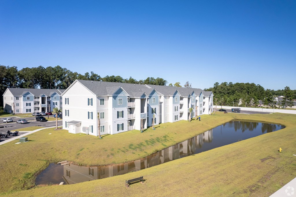 a building with a pond in front of it