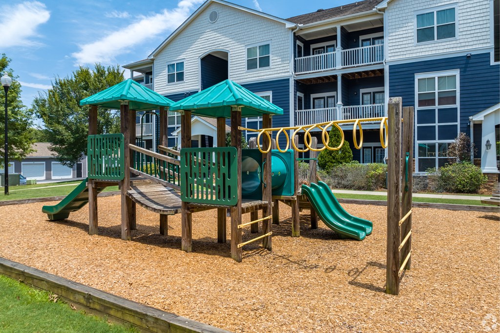 a playground at the whispering winds apartments in pearland, tx