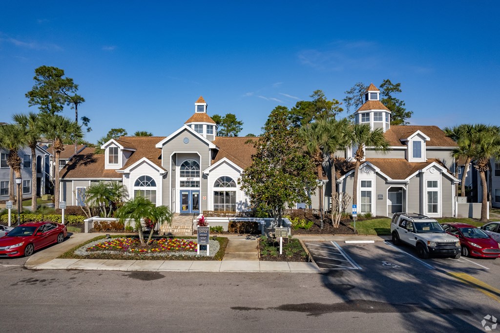 a row of houses with cars parked in front of them at The Adelaide, Orlando, 32821