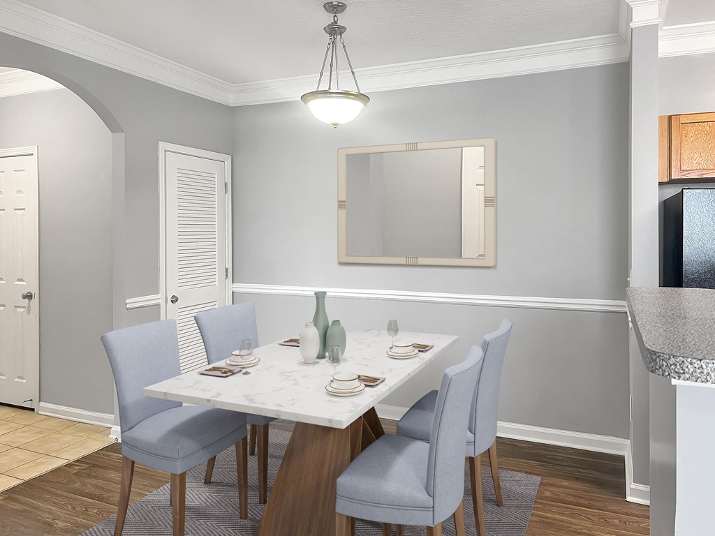 an image of a dining room with a table and chairs