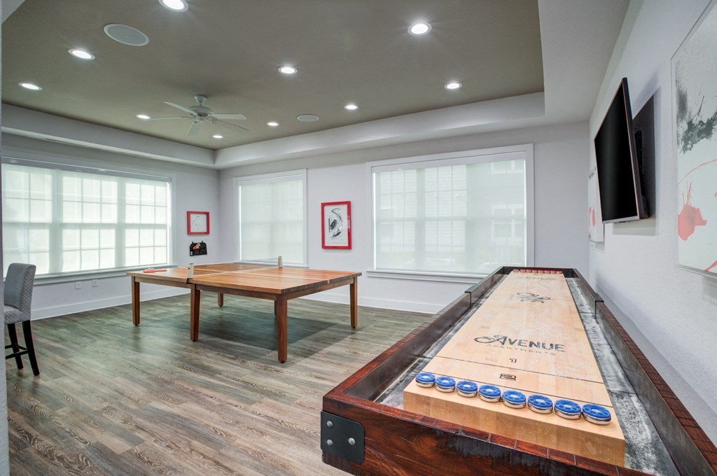 a games room with a shuffleboard table and a foosball table  Flyer at Century Avenues, Lakeland, FL, 33813