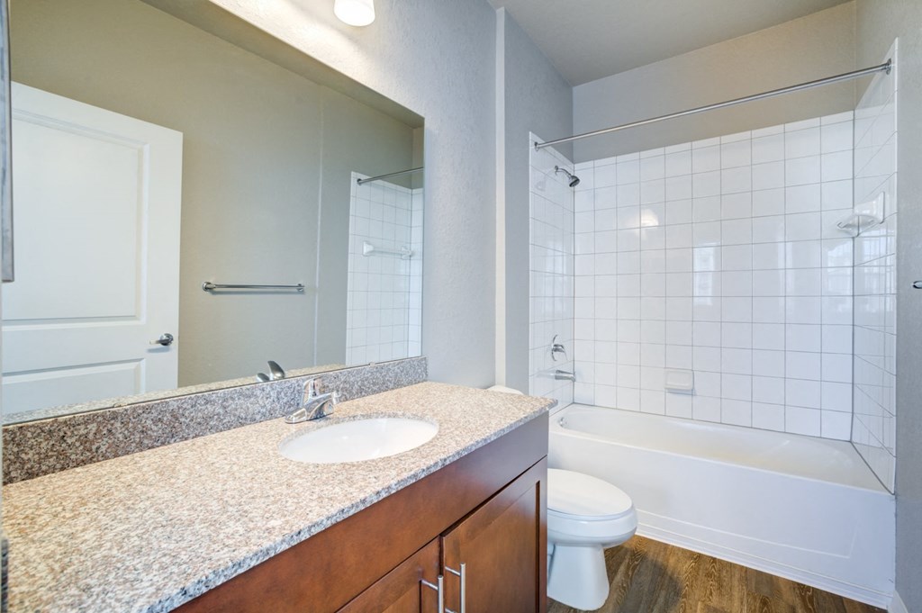 a bathroom with a toilet sink and shower  at Century Avenues, Florida