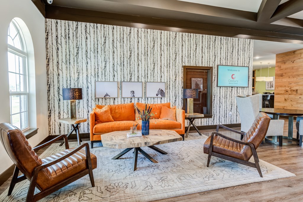 a living room filled with furniture and a large window at Century Belmont Station, Kentucky