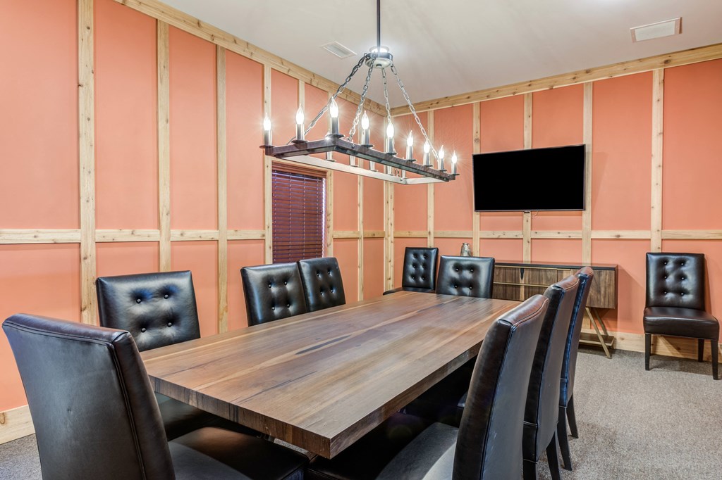 accommodation type with a large wooden table and black leather chairs at Century Belmont Station, Louisville, KY, 40243