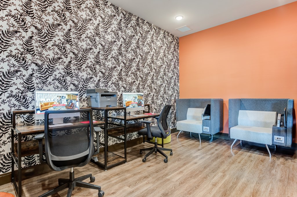 a workspace with two desks two chairs and a printer at Century Belmont Station, Louisville, Kentucky