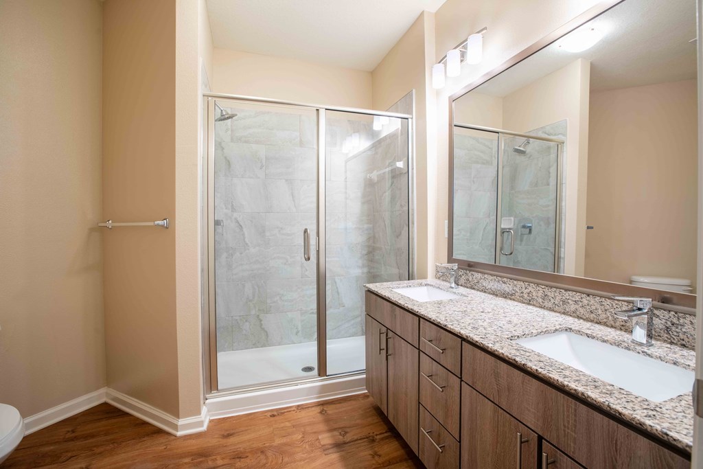 a bathroom with a sink and a shower at Century Dunes Apartments, Deland, 32724