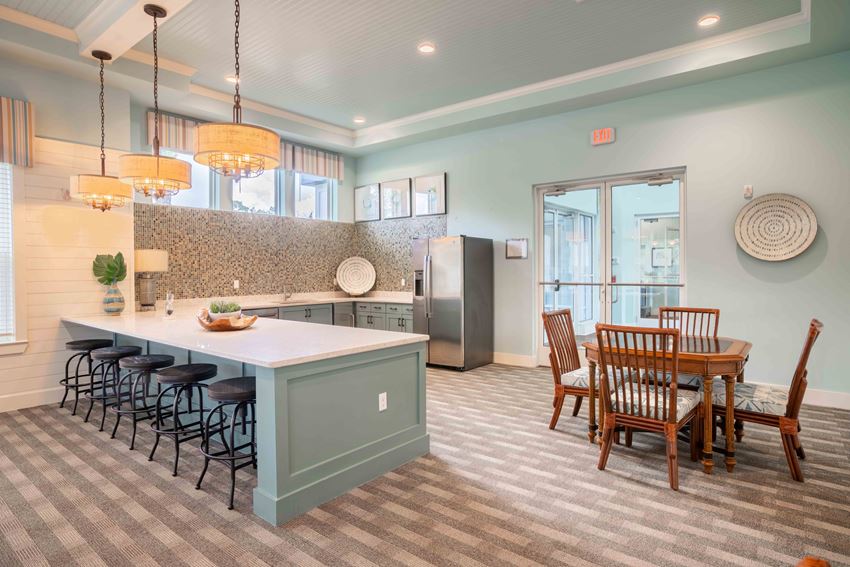 an open kitchen and dining room with a table and chairs
