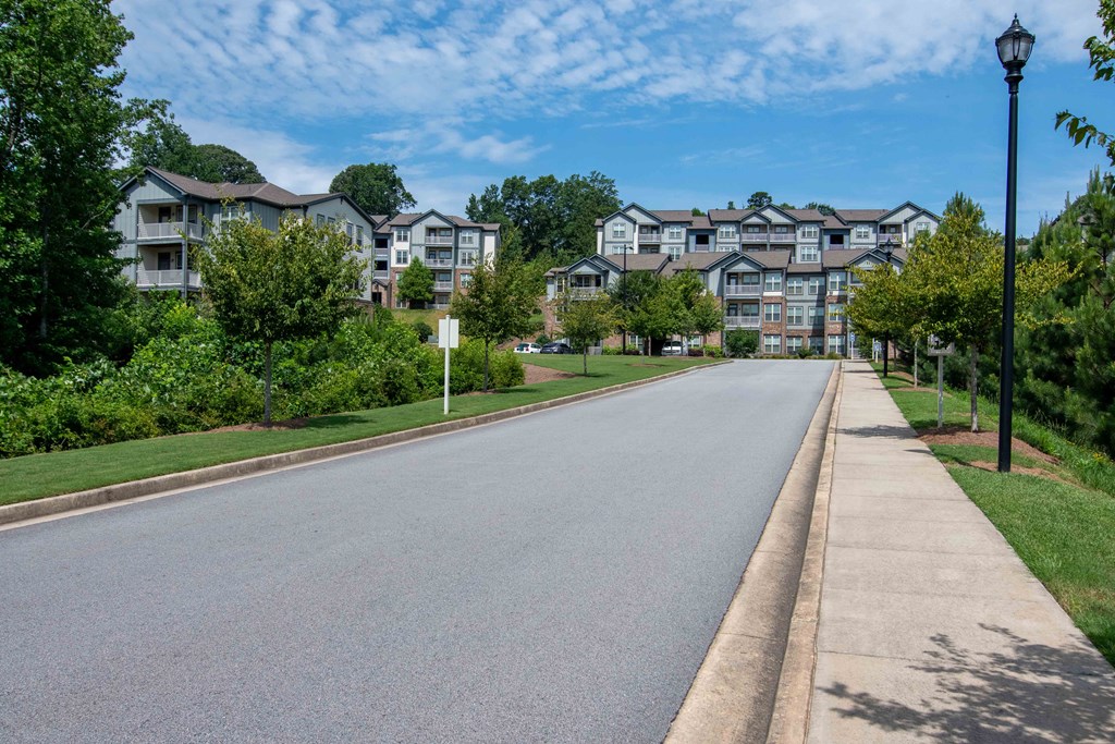 an empty street with apartment buildings on the side of it  at Century New Holland, Georgia