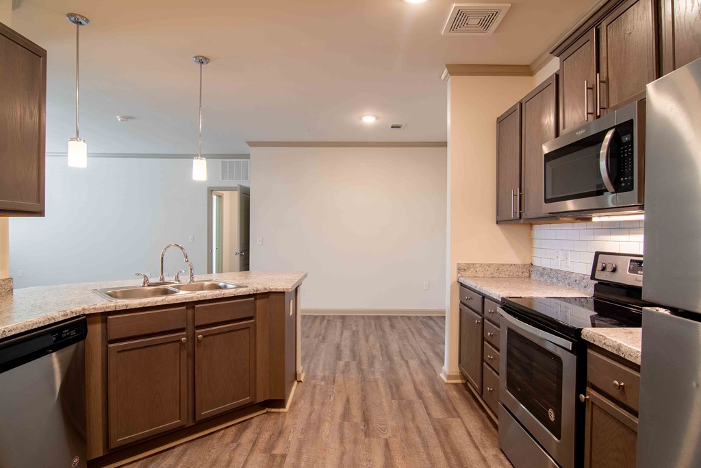 a kitchen with stainless steel appliances and a counter top at Century New Holland, Gainesville, Georgia