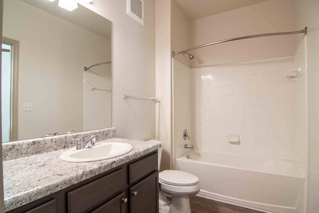 a bathroom with a sink toilet and shower at Century New Holland, Georgia
