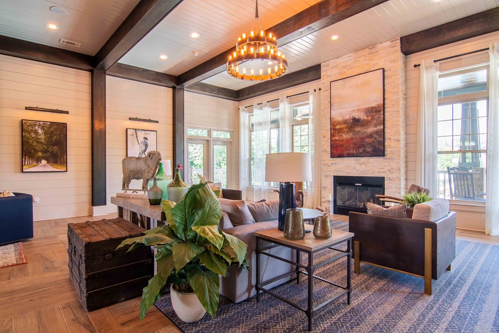 a living room with a couch and a fireplace at Century New Holland, Gainesville