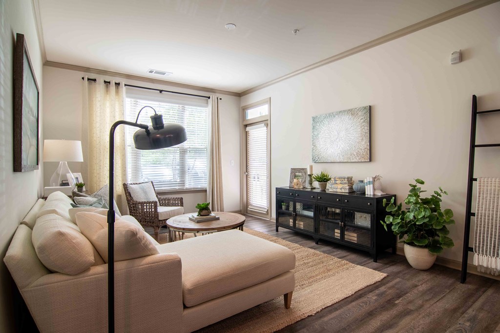 a living room with a couch and a table  at Century New Holland, Gainesville, 30501