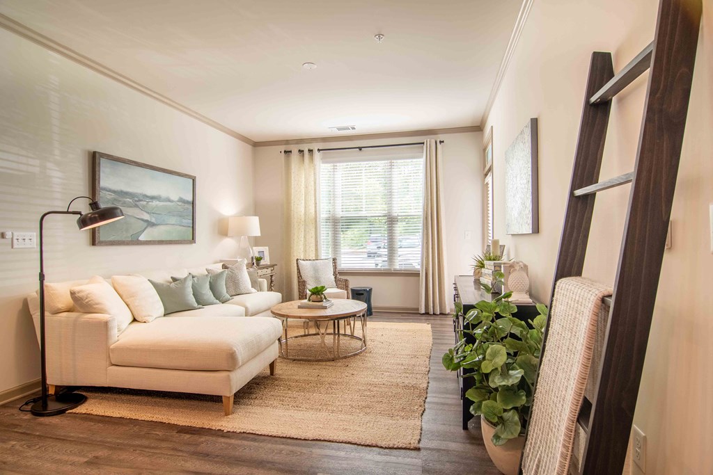 a living room with a couch and a table at Century New Holland, Gainesville, Georgia
