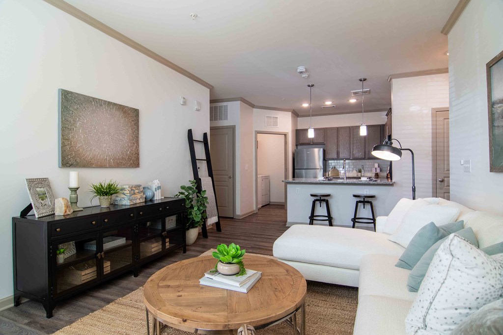 a living room with a couch and a table  at Century New Holland, Gainesville, 30501