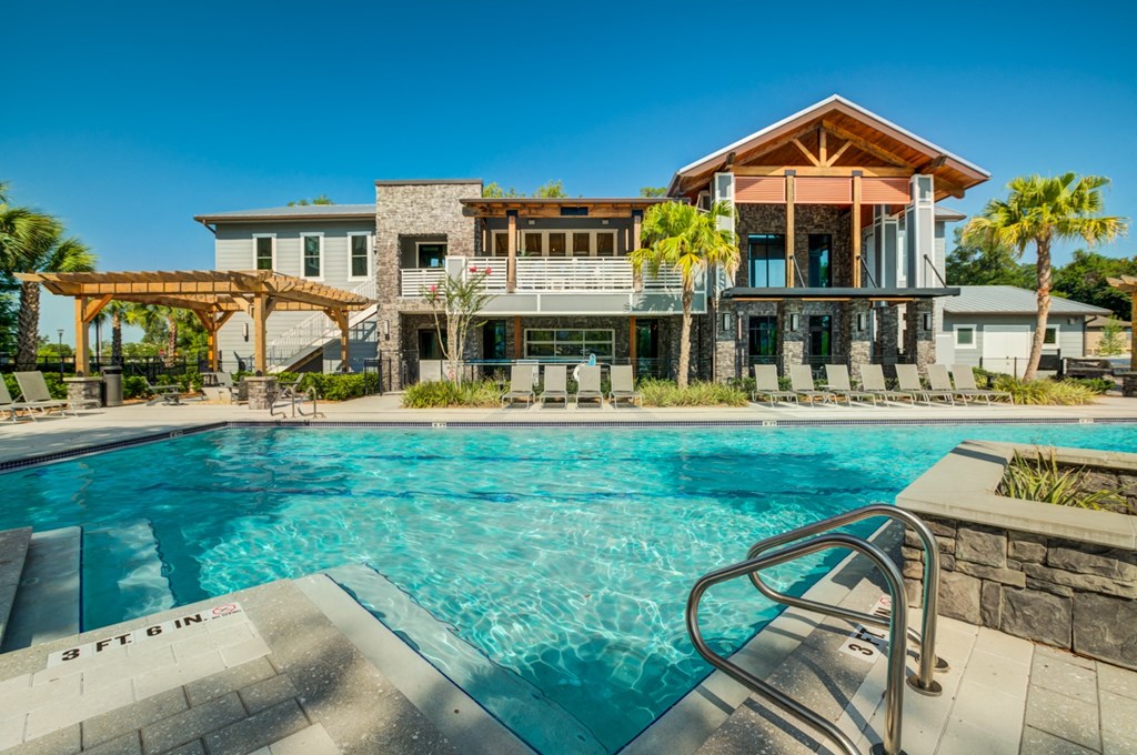 a swimming pool in front of a house with a pool at Century Town Center, Gainesville, 32607