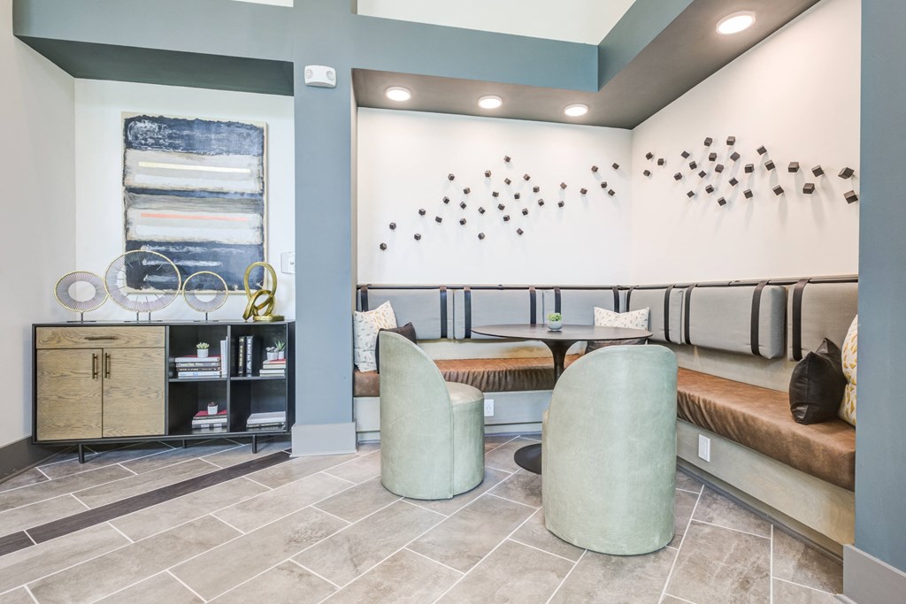 a seating area with two chairs and a tableat Century University City, Charlotte, 28213