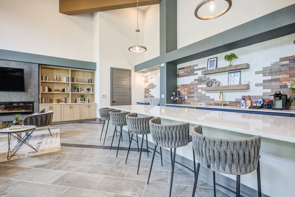 take a seat at the bar in the clubhouse at ascend at woodbury new luxury apartments inat Century University City, Charlotte, North Carolina