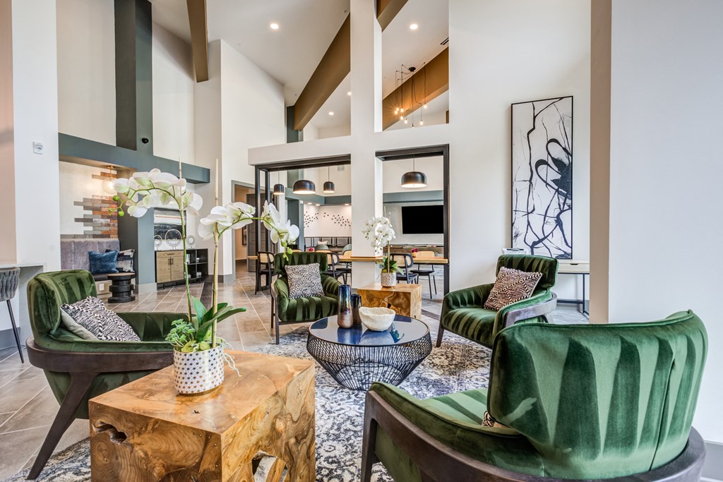 a living room filled with furniture and a large window at Century University City, Charlotte, 28213