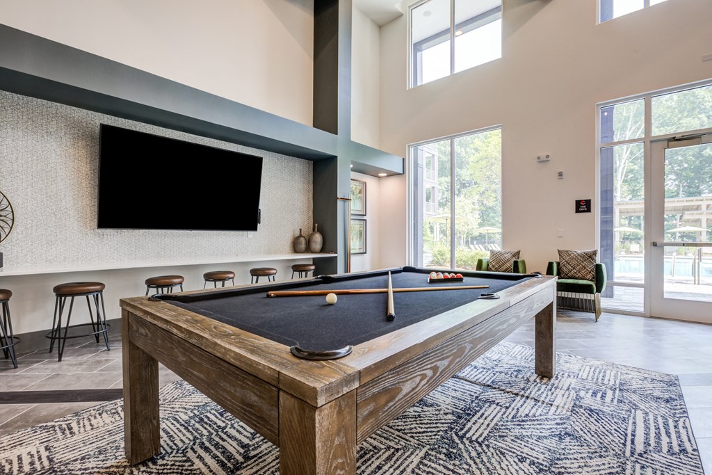 our apartments have a game room with a pool table and flat screen tv at Century University City, Charlotte, 28213