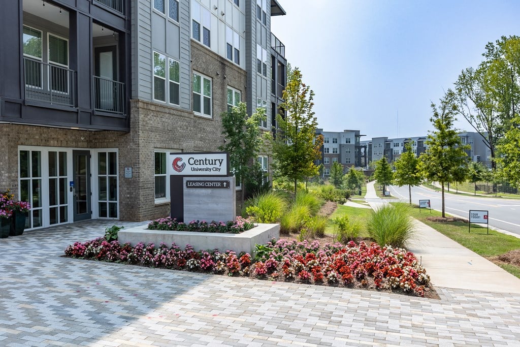 a building entrance with a sign that says canterburyat Century University City, North Carolina, 28213