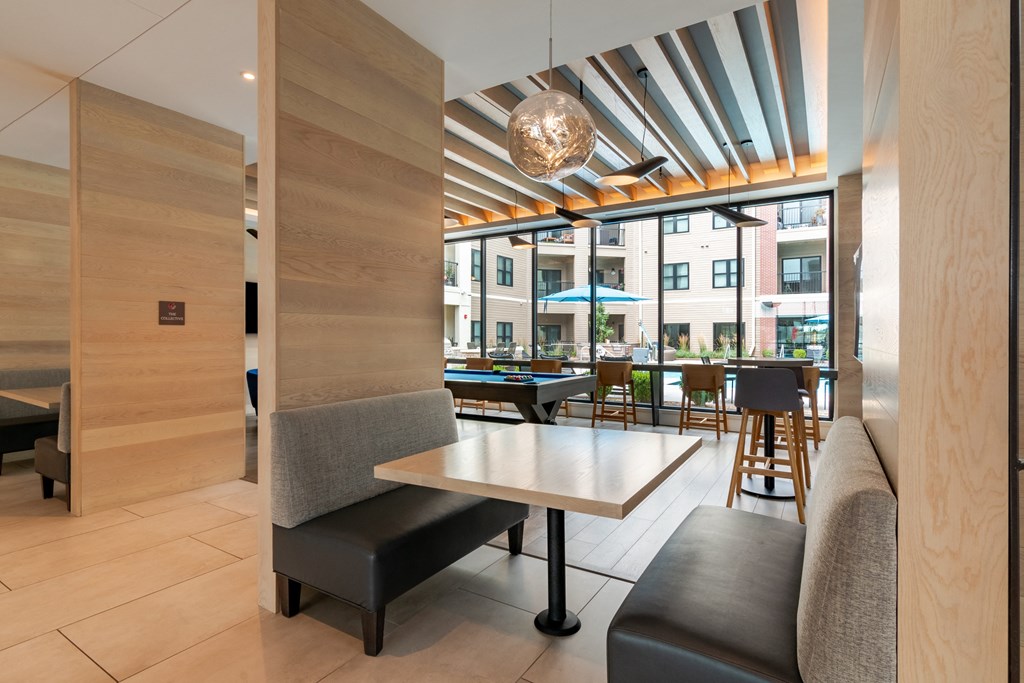 a room filled with furniture and a large window  at Century West Pryor, Lee's Summit, MO