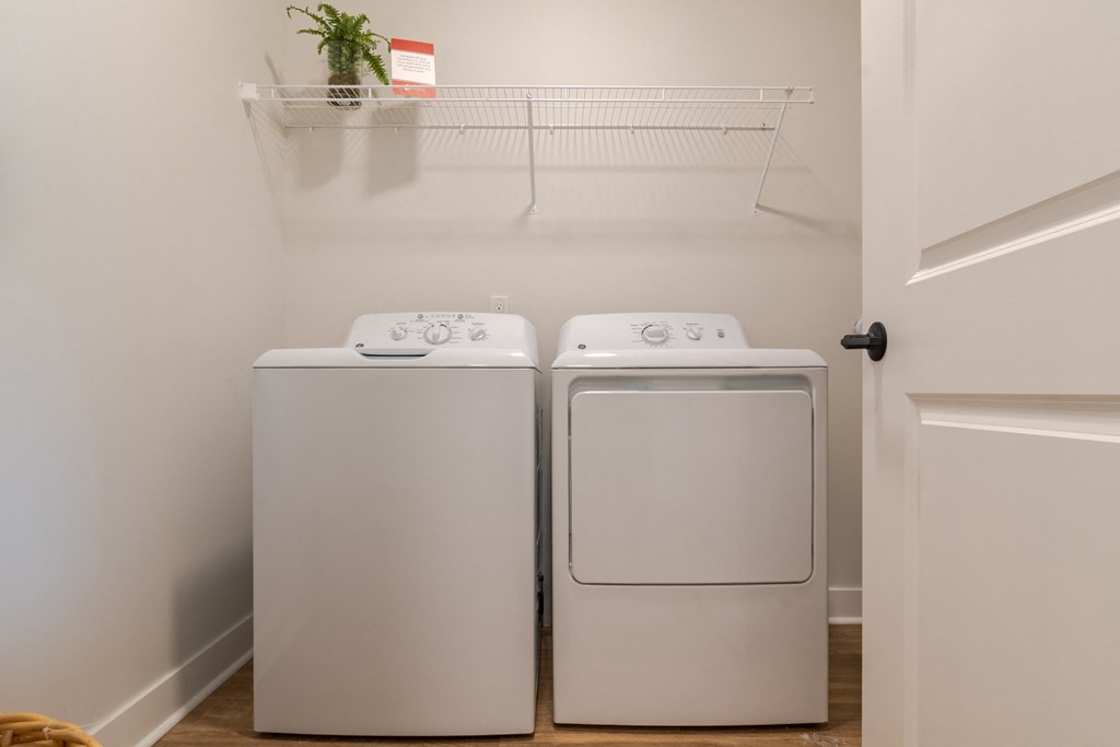 a washer and dryer in a laundry room  at Century West Pryor, Missouri, 64081