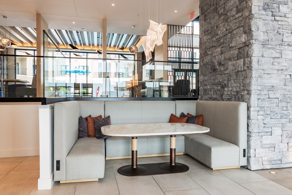 a seating area with two couches and a table  at Century West Pryor, Lee's Summit, MO